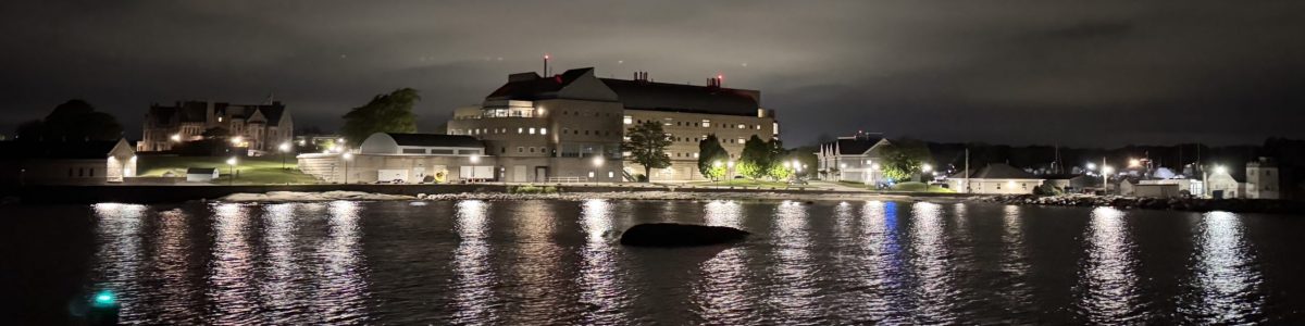University of Connecticut campus at night from the water