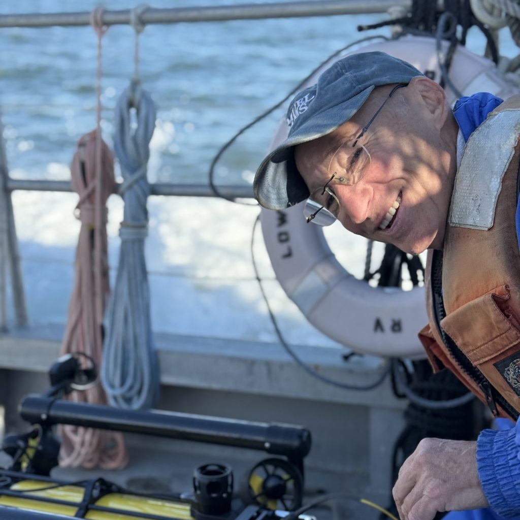 Photo of Dennis Arbige with the ROV on the R/V Weicker